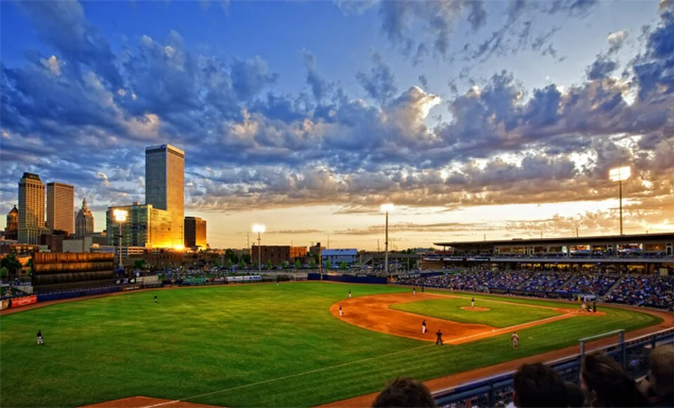 Archival sunset view across ONEOK Field toward downtown Tulsa